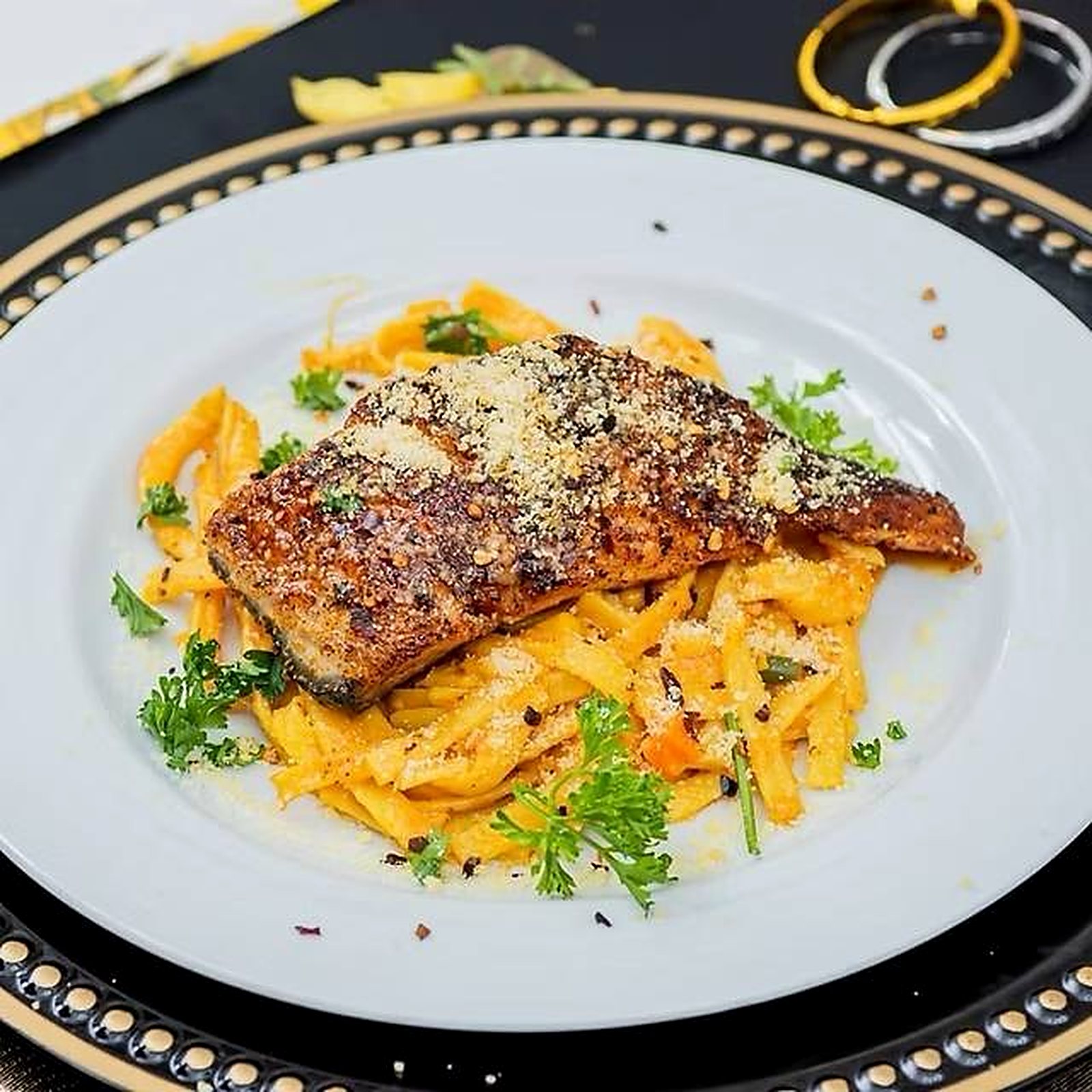 Blackened salmon over rasta pasta